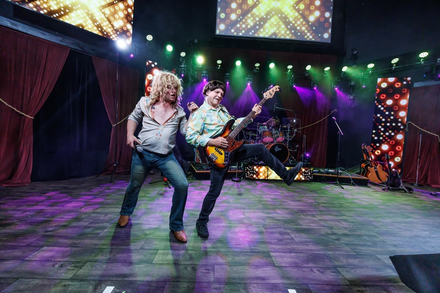 British Invasion performers under the stage lights in Branson