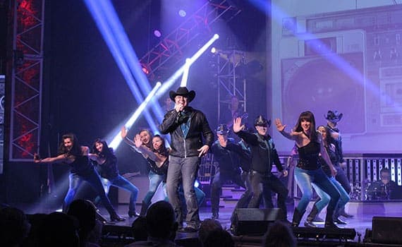 Clay Cooper performing country music on stage in Branson Missouri