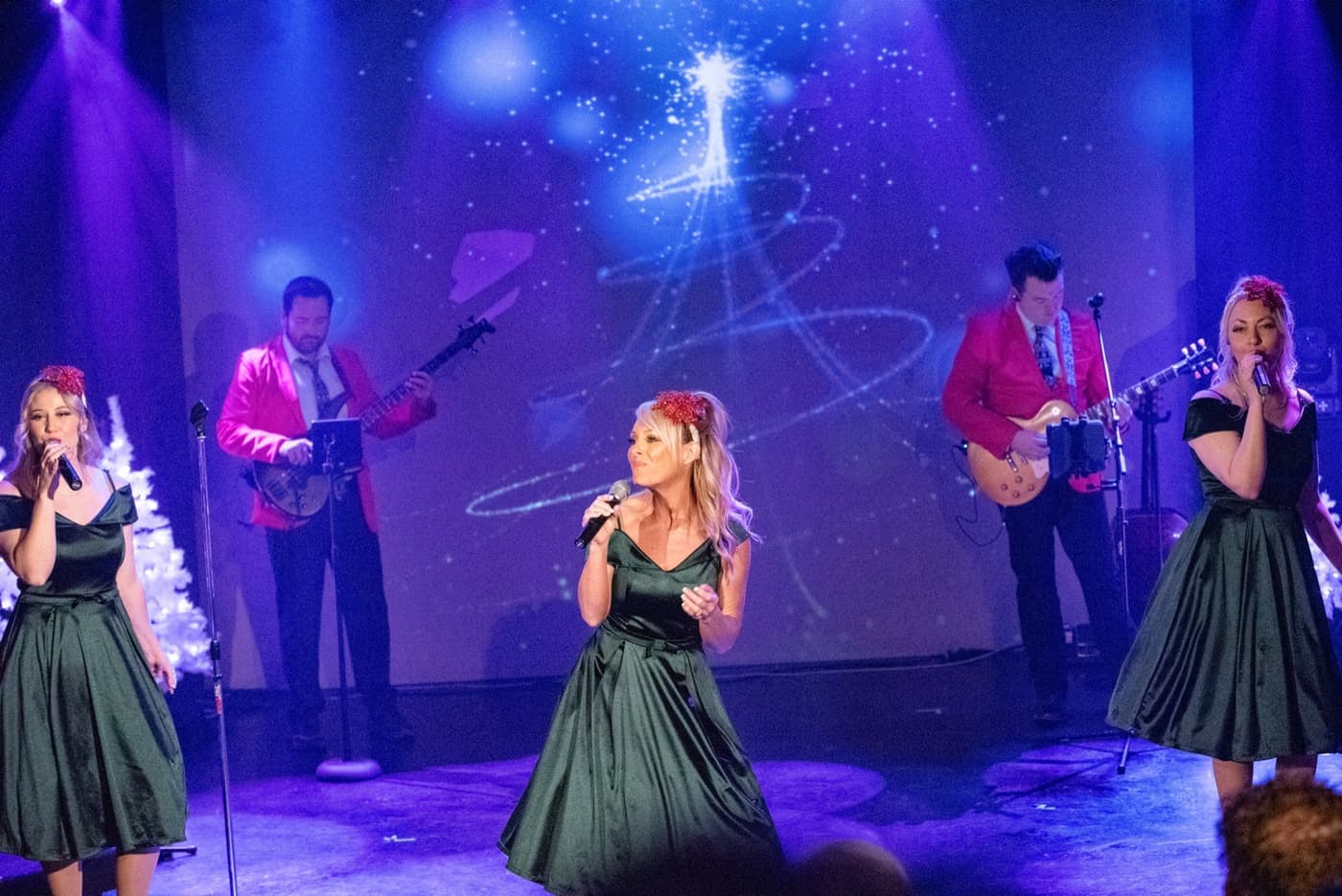 Matthew Boyce's Retro Christmas performers under the stage lights in Branson