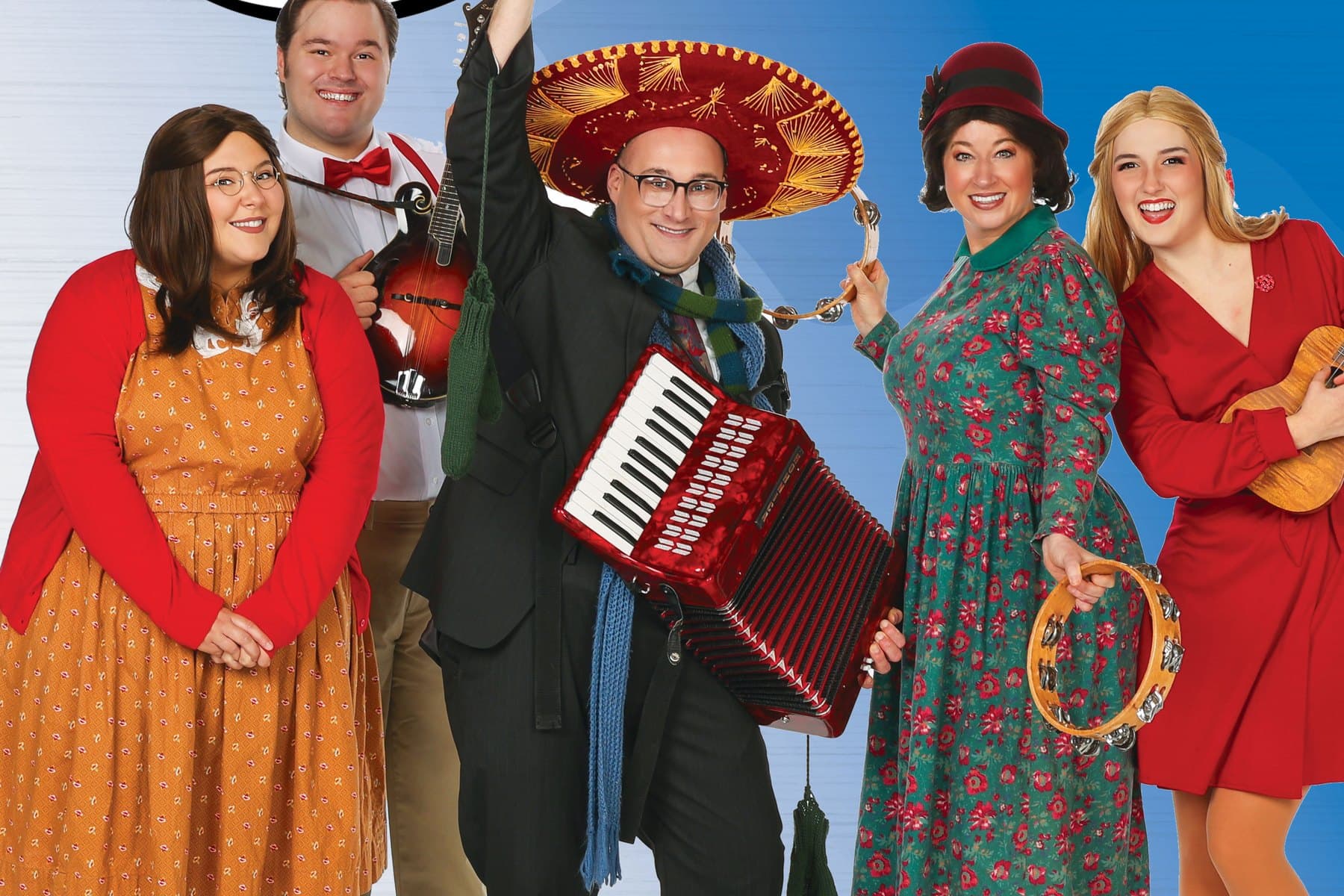The Sanders Family Christmas cast in holiday costumes with accordion and mandolin in Branson