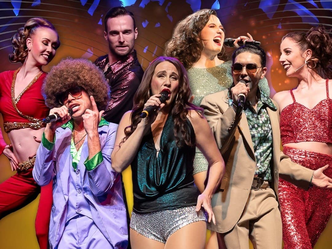 The Ultimate 70's Show cast in disco costumes at King's Castle Theatre in Branson