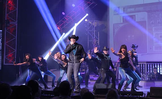 Clay Cooper performing country music on stage in Branson Missouri